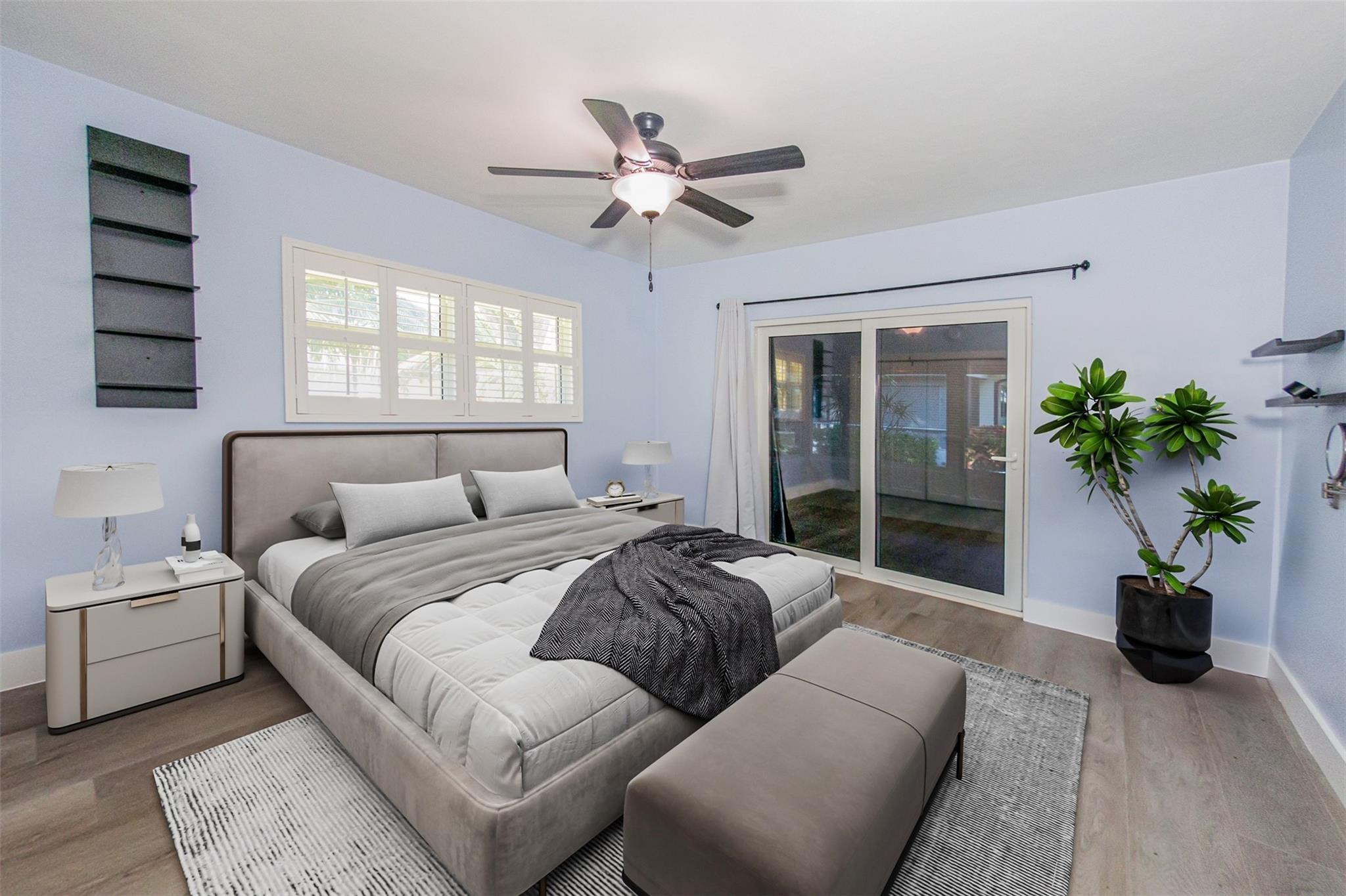 1991 Northeast 32nd Street, Unit 18 Lighthouse Point, FL 33064 - Photo 6 of 39 a living room with a bed furniture and potted plant