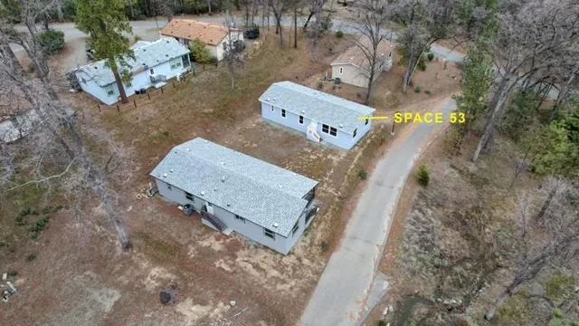 a view of a town with mountains in the background