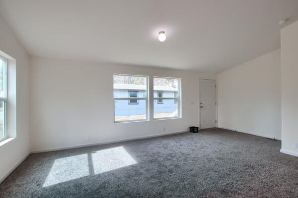 43555 Highway 41, Unit 53 Oakhurst, CA 93644 - Photo 4 of 28 an empty room with windows