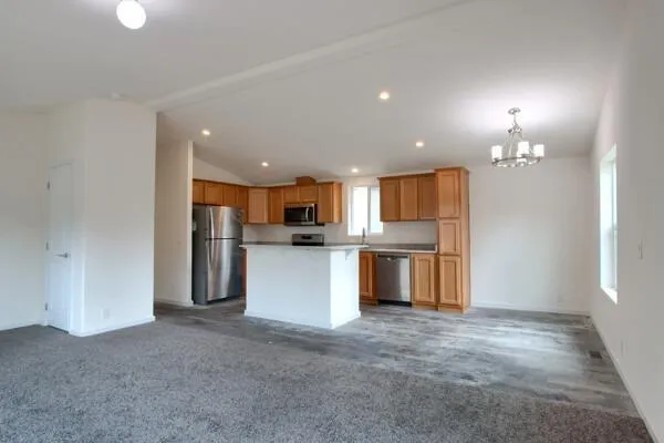 a view of kitchen and refrigerator