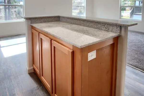 a view of a kitchen from a hallway