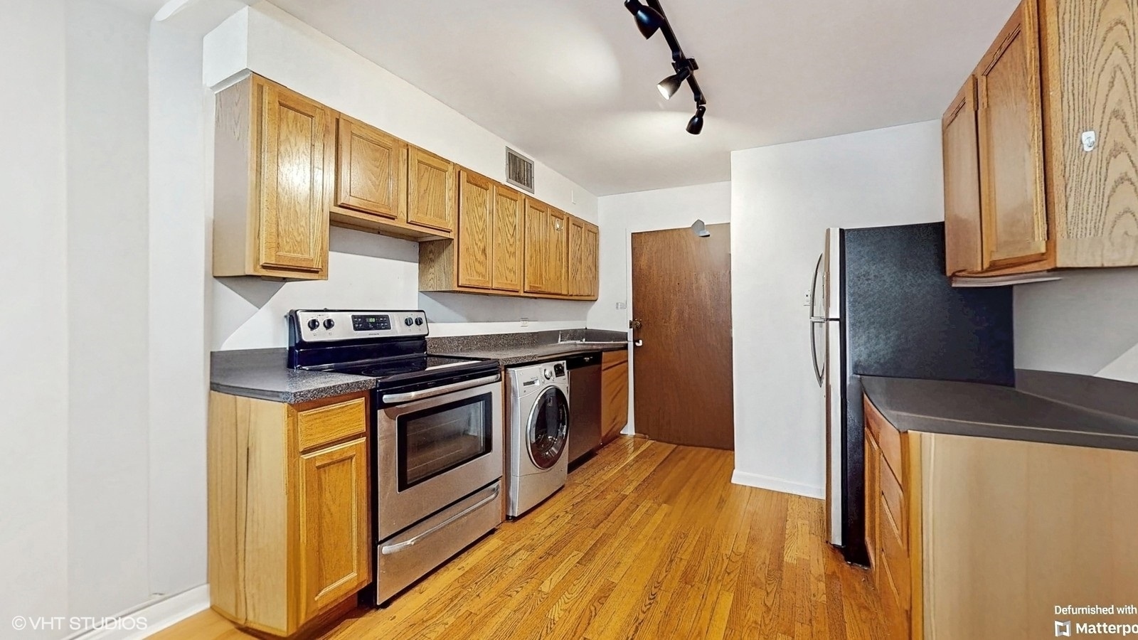 1567 Ridge Avenue, Unit 307 Evanston, IL 60201 - Photo 6 of 19 a kitchen with stainless steel appliances granite countertop a stove and a refrigerator