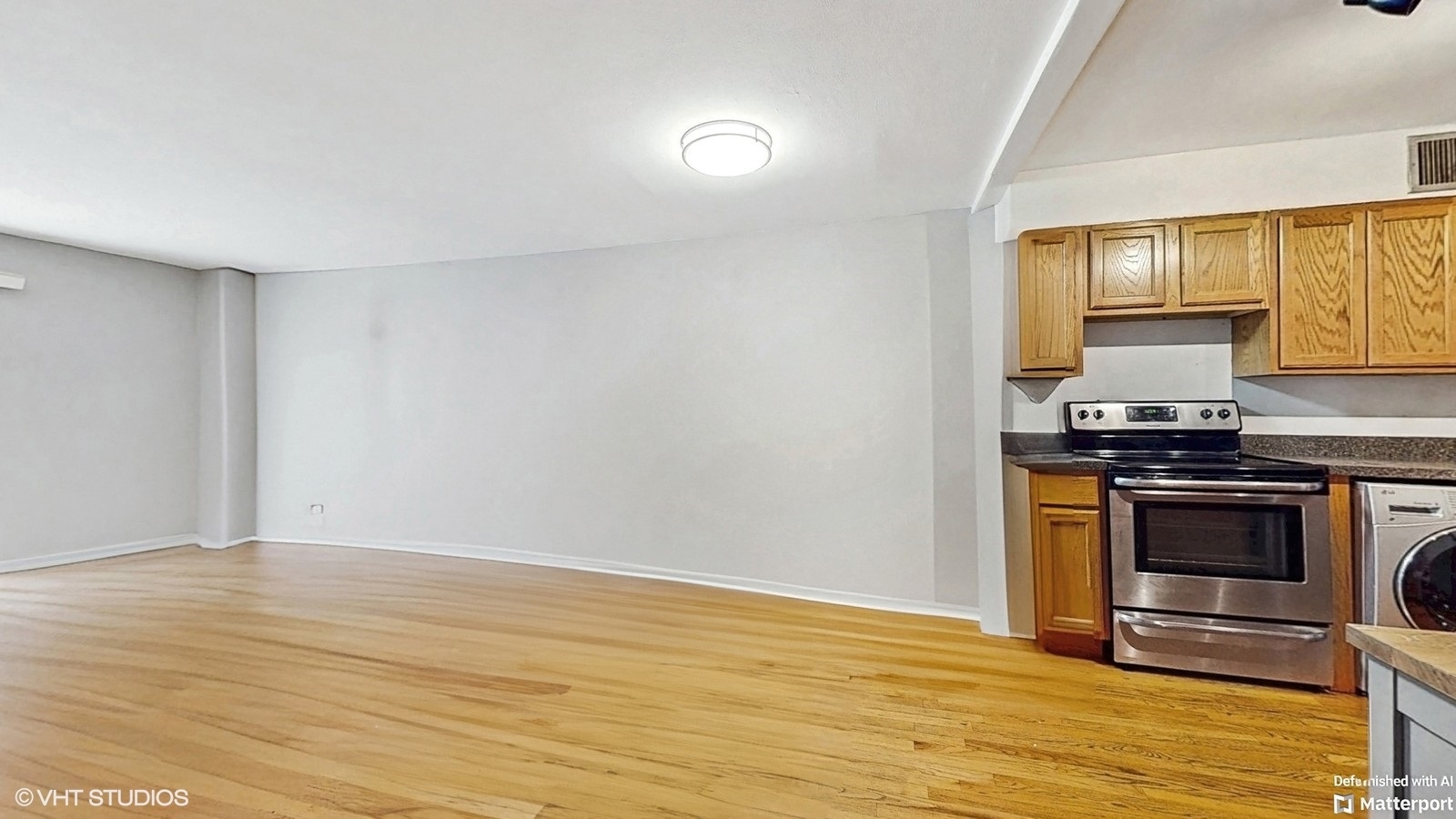 1567 Ridge Avenue, Unit 307 Evanston, IL 60201 - Photo 7 of 19 a kitchen with stainless steel appliances a stove and a microwave