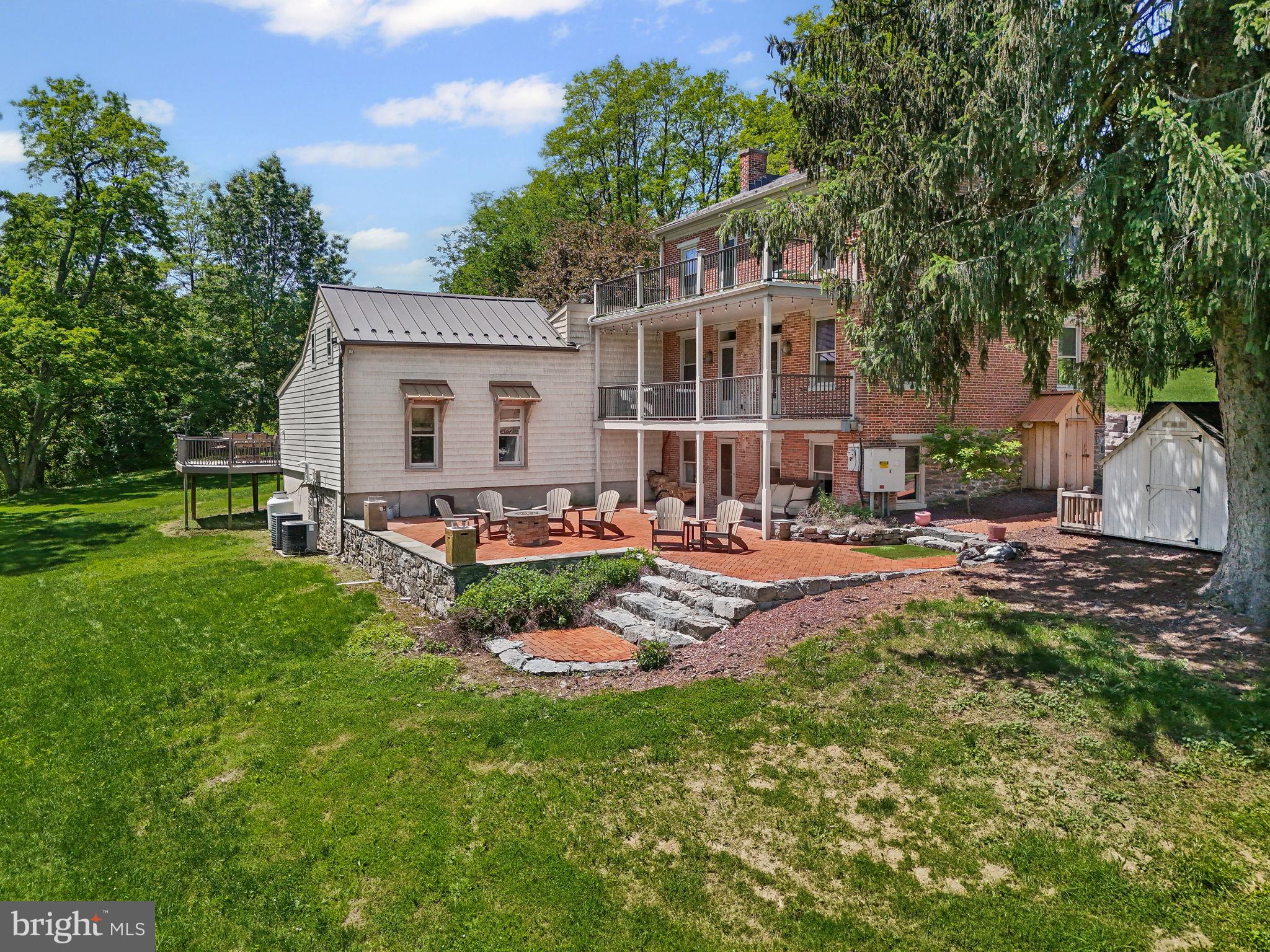 154 Calvary Church Road Wrightsville, PA 17368 - Photo 2 of 89 a view of a backyard with table and chairs potted plants and large tree