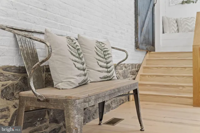 a spacious bedroom with a bed and cabinet