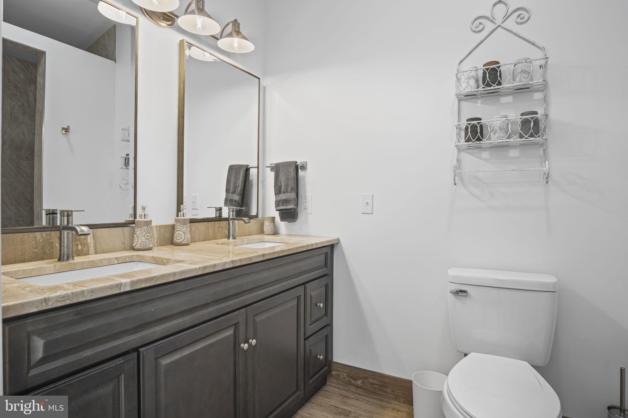 154 Calvary Church Road Wrightsville, PA 17368 - Photo 45 of 89 a bathroom with a granite countertop toilet sink and mirror