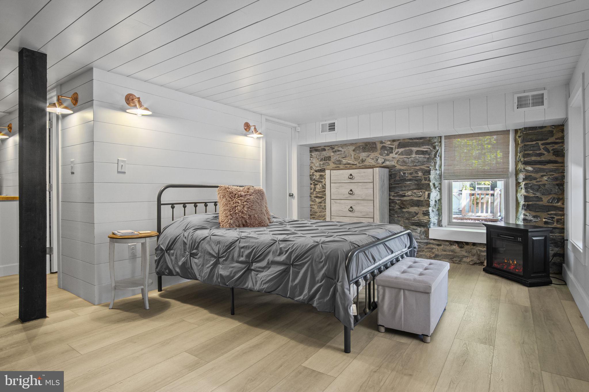 154 Calvary Church Road Wrightsville, PA 17368 - Photo 50 of 89 a bedroom with a bed and wooden floor