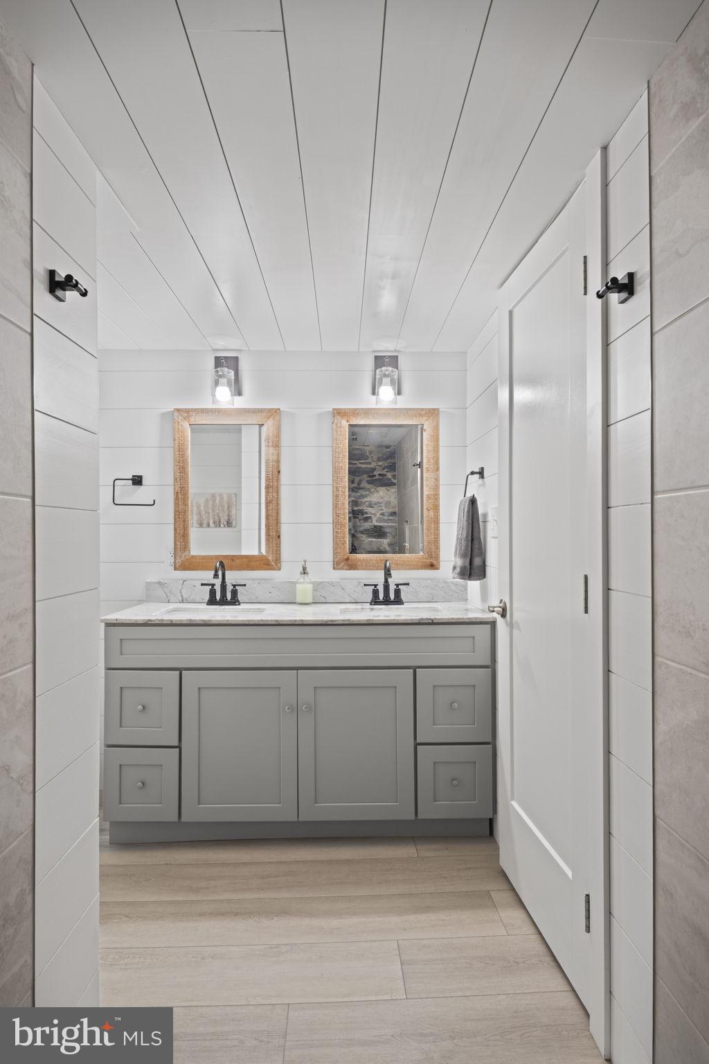 154 Calvary Church Road Wrightsville, PA 17368 - Photo 57 of 89 a spacious bathroom with a double vanity sink a mirror and a bathtub