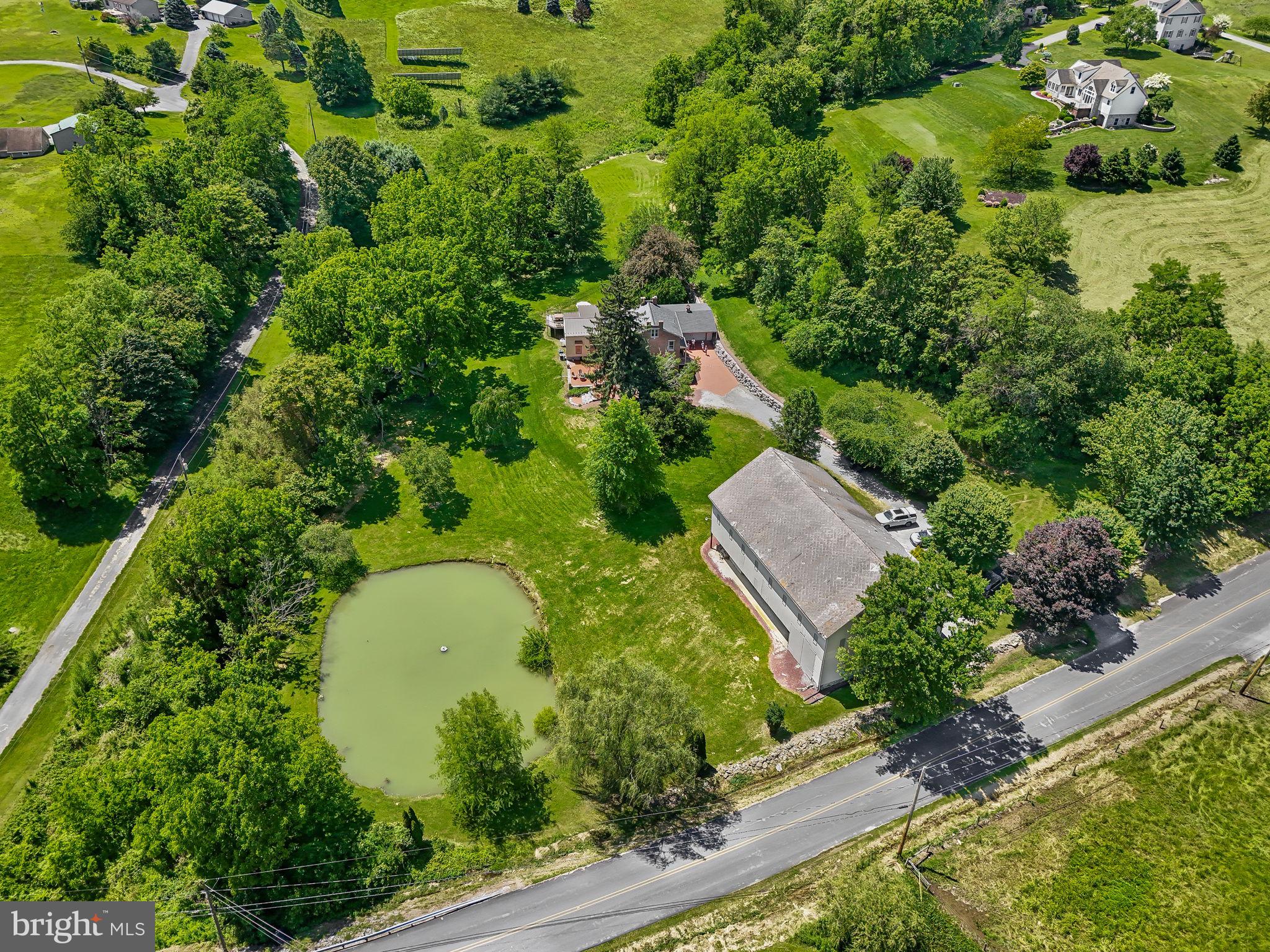154 Calvary Church Road Wrightsville, PA 17368 - Photo 88 of 89 an aerial view of a house with a yard and lake view