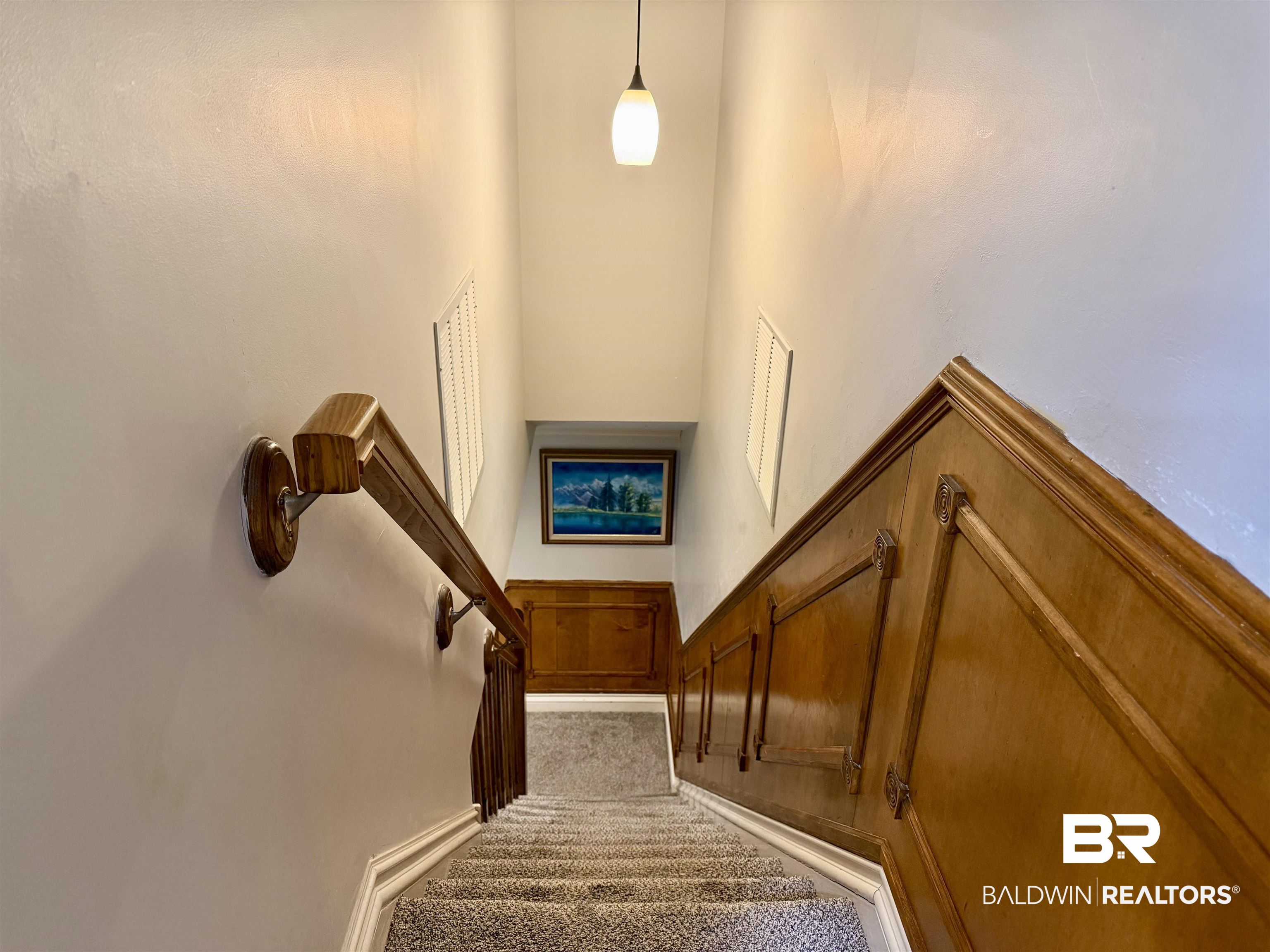 2944 Appleton Road Brewton, AL 36426 - Photo 36 of 65 Stairway with wainscoting and a decorative wall