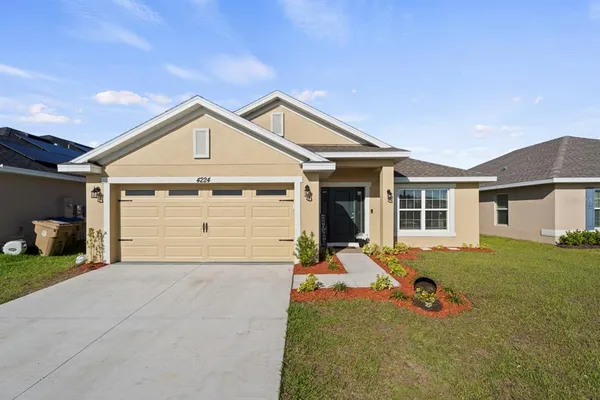 a front view of a house with a outdoor space