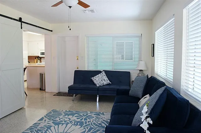 a living room with furniture and a window