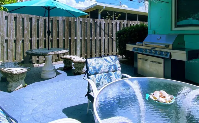 a backyard of a house with yard fire pit and outdoor seating
