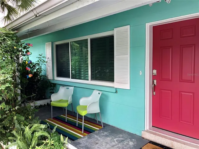 a chair and table in front of a door