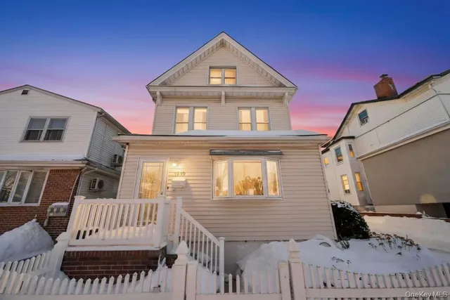 a view of a house with wooden deck