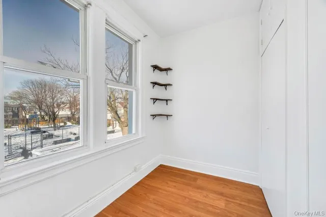 a view of a room that has a window and a view of window