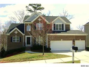 152 Lighthouse Road Mount Holly, NC 28120 - Photo 1 of 16 a front view of a house with garden