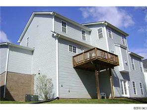 152 Lighthouse Road Mount Holly, NC 28120 - Photo 13 of 16 a view of a house with a wooden fence