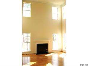 152 Lighthouse Road Mount Holly, NC 28120 - Photo 3 of 16 a view of a livingroom with wooden floor and a fireplace