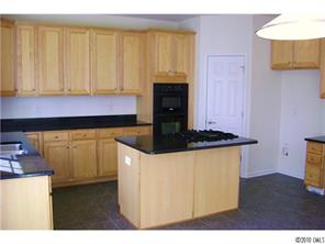 152 Lighthouse Road Mount Holly, NC 28120 - Photo 5 of 16 a kitchen with a stove and a microwave