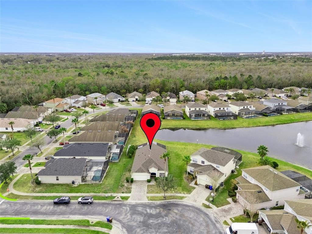 1202 Winding Cypress Court Kissimmee, FL 34746 - Photo 1 of 41 an aerial view of houses with a lake