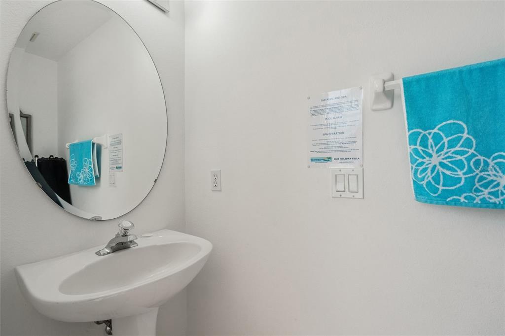 1202 Winding Cypress Court Kissimmee, FL 34746 - Photo 26 of 41 a bathroom with a sink and a mirror