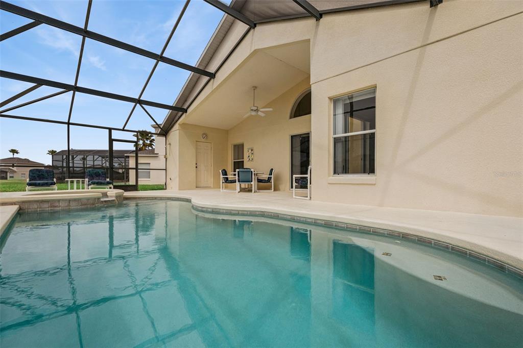 1202 Winding Cypress Court Kissimmee, FL 34746 - Photo 31 of 41 a kitchen with a sink and cabinets