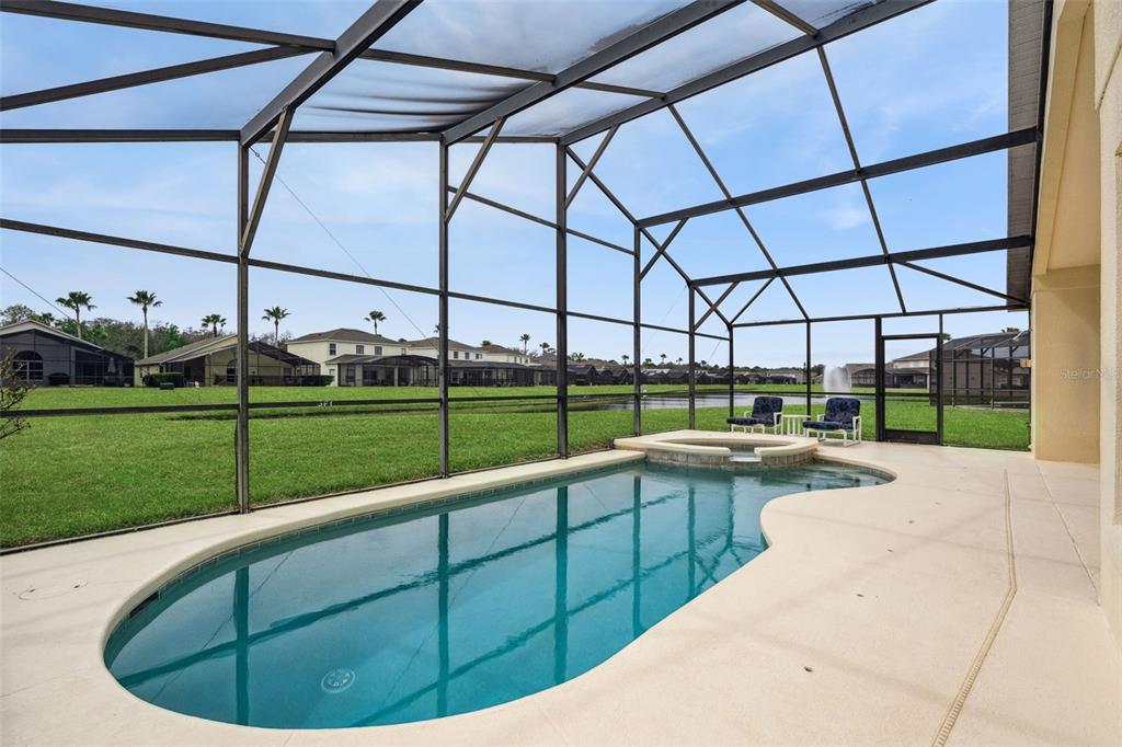 1202 Winding Cypress Court Kissimmee, FL 34746 - Photo 33 of 41 a view of outdoor space with swimming pool and outdoor seating