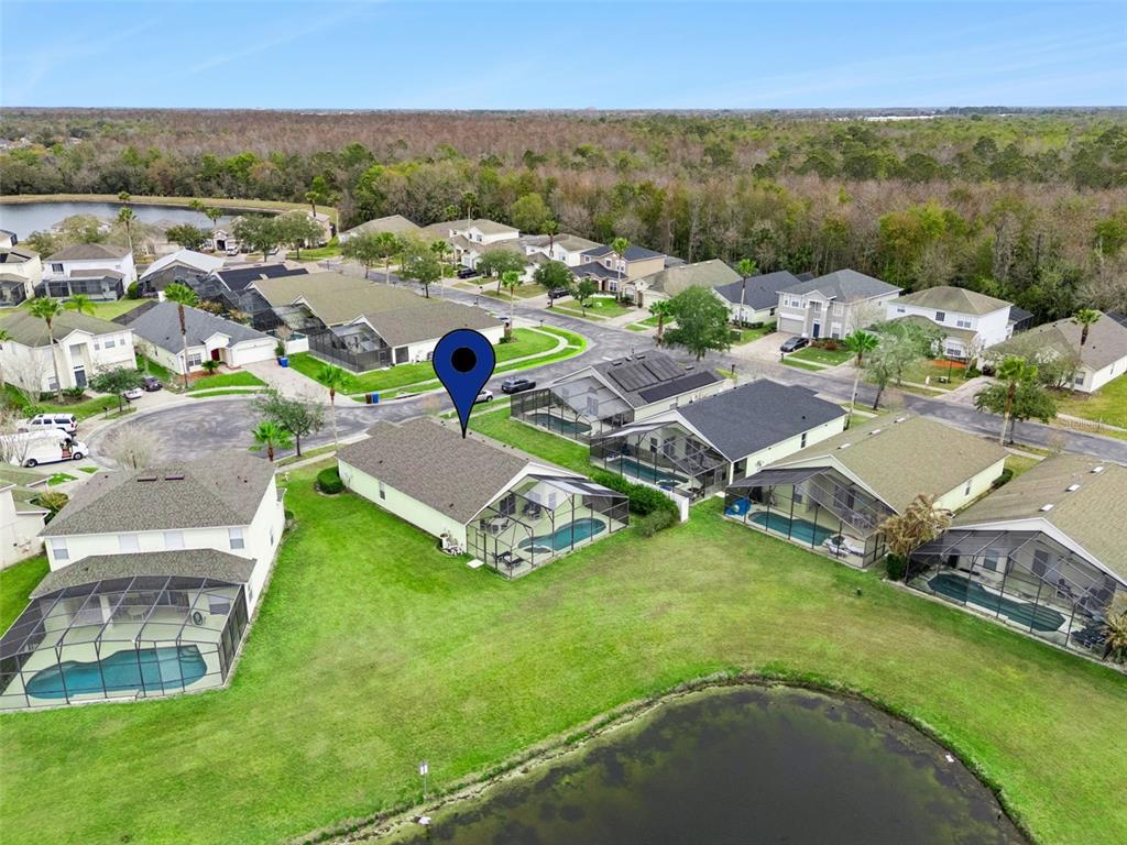 1202 Winding Cypress Court Kissimmee, FL 34746 - Photo 36 of 41 an aerial view of residential houses with outdoor space and river