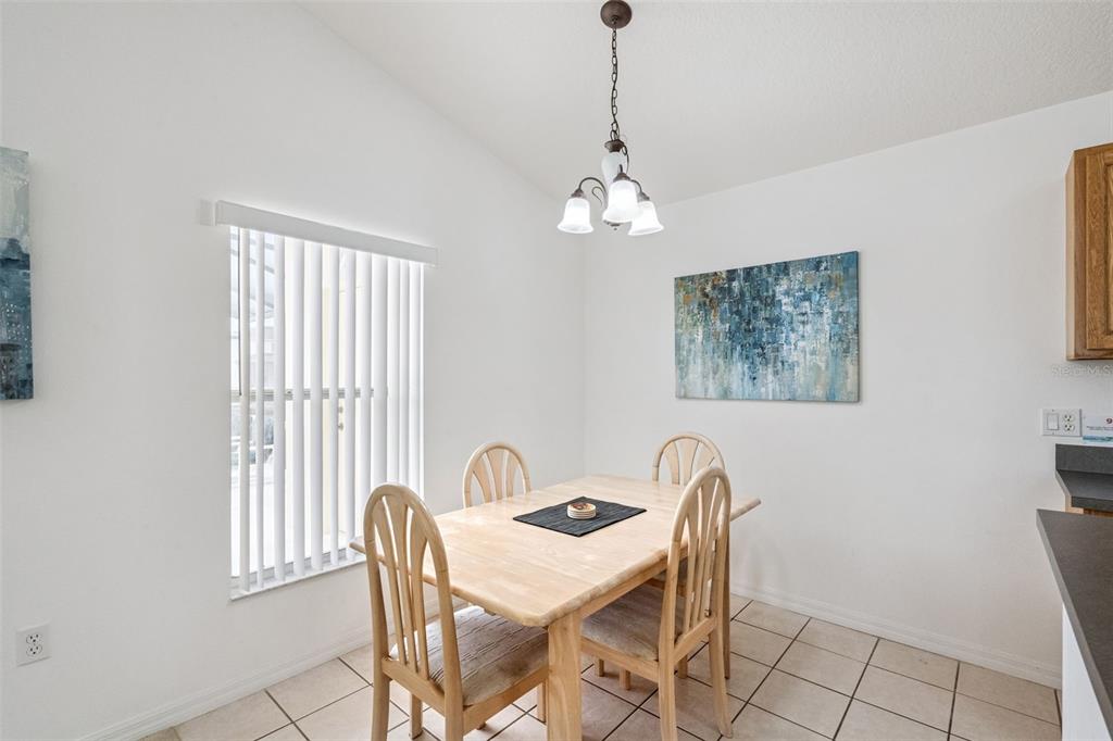 1202 Winding Cypress Court Kissimmee, FL 34746 - Photo 9 of 41 a view of a dining room with furniture window and outside view