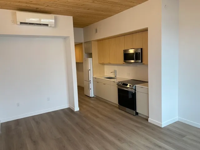 a kitchen with a sink and a stove top oven