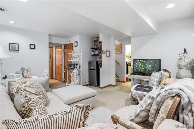 a bedroom with two beds and a couch