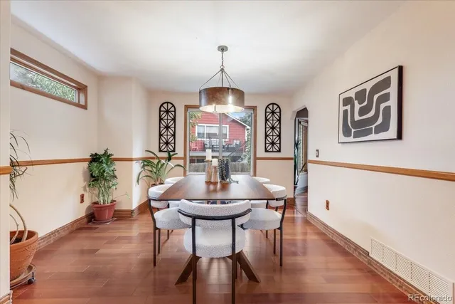 a dining room with furniture and window