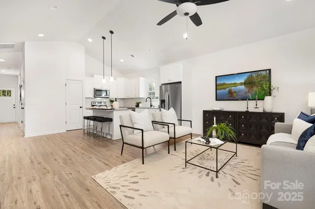 a living room with furniture and a flat screen tv