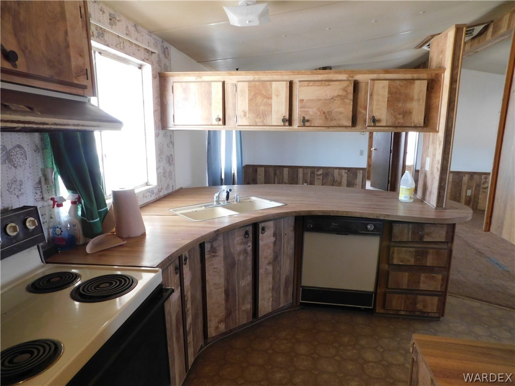 3539 Mobile Road Golden Valley, AZ 86413 - Photo 11 of 18 a kitchen with a stove and a sink