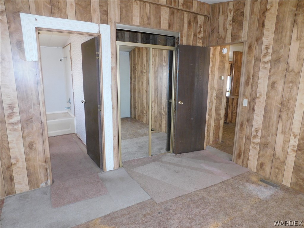 3539 Mobile Road Golden Valley, AZ 86413 - Photo 15 of 18 a view of a hallway with wooden shelves