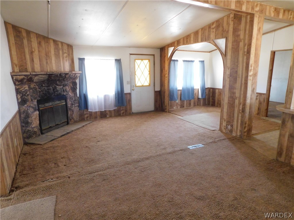 3539 Mobile Road Golden Valley, AZ 86413 - Photo 6 of 18 a view of a livingroom with a fireplace