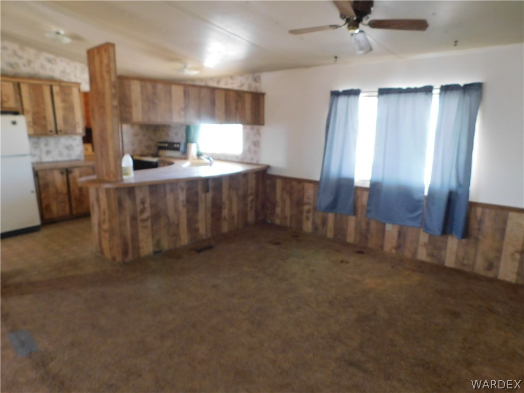 3539 Mobile Road Golden Valley, AZ 86413 - Photo 8 of 18 a kitchen with stainless steel appliances a refrigerator sink and stove