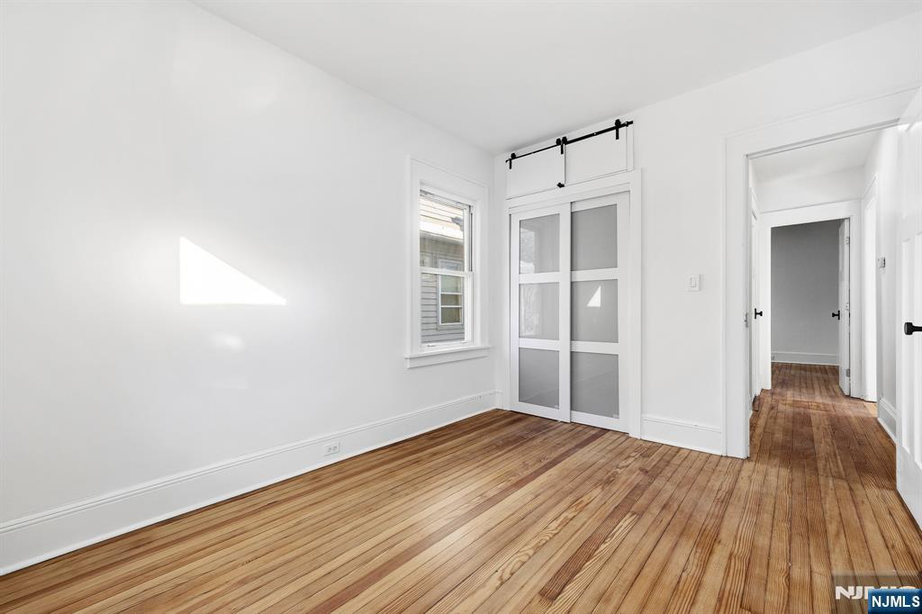 159 2nd Avenue Hawthorne, NJ 07506 - Photo 11 of 26 a view of empty room with wooden floor