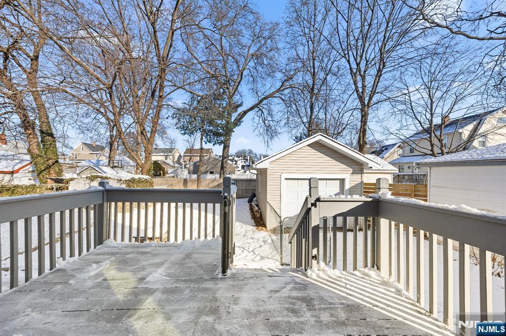 159 2nd Avenue Hawthorne, NJ 07506 - Photo 14 of 26 a view of a house with a wooden fence and trees