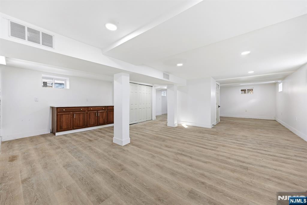 159 2nd Avenue Hawthorne, NJ 07506 - Photo 22 of 26 a view of an empty room with wooden floor