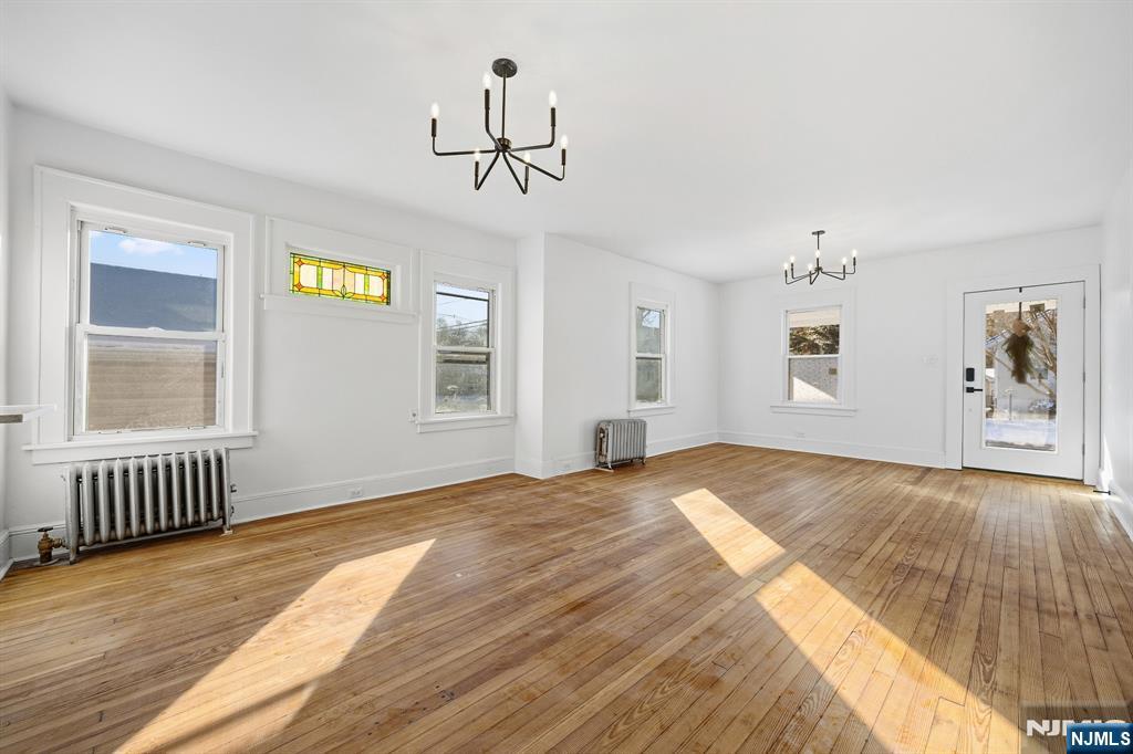 159 2nd Avenue Hawthorne, NJ 07506 - Photo 8 of 26 a bedroom with a bed and window