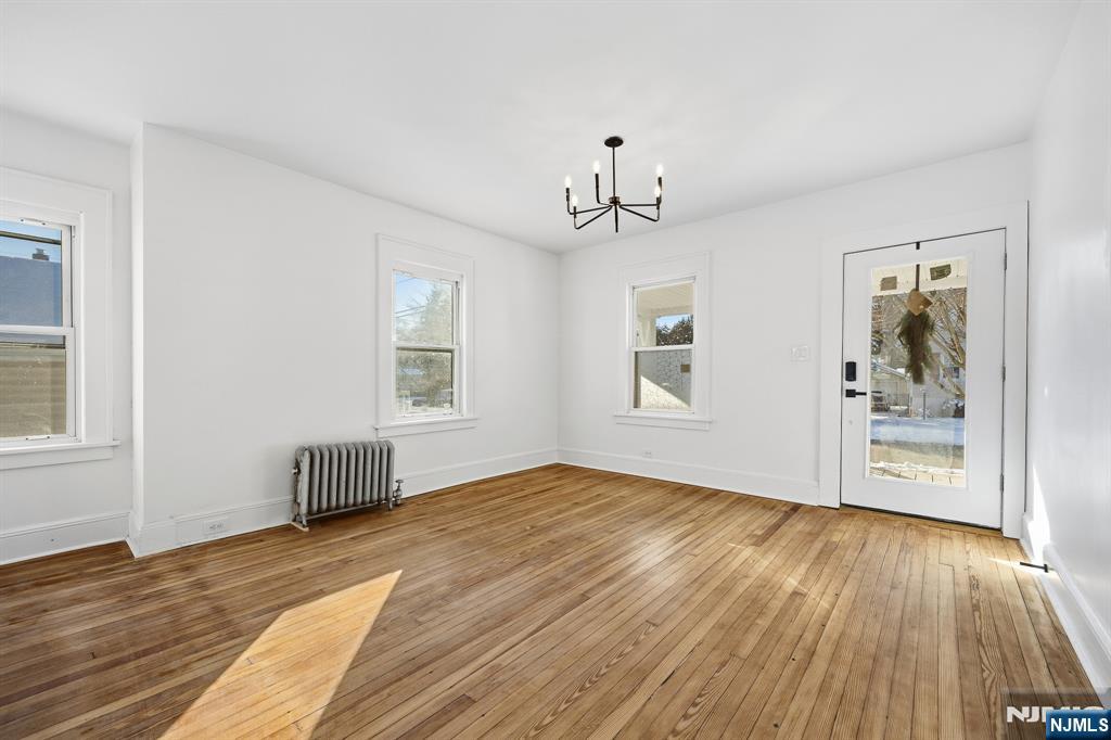 159 2nd Avenue Hawthorne, NJ 07506 - Photo 9 of 26 a view of empty room with wooden floor and fan