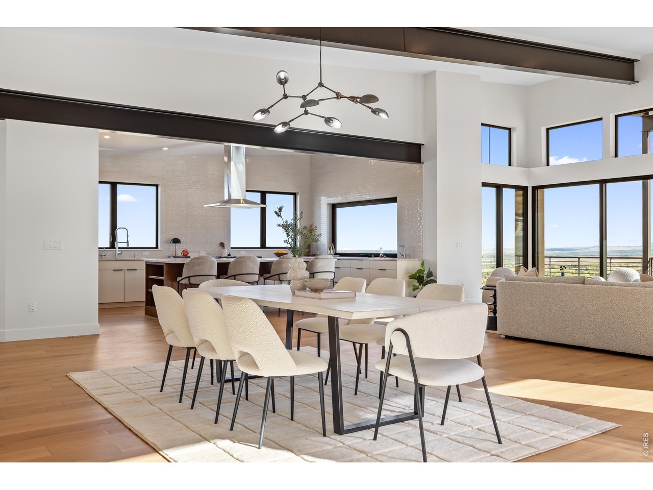 9578 Mountain Ridge Drive Boulder, CO 80302 - Photo 14 of 47 a view of a dining room with furniture and wooden floor