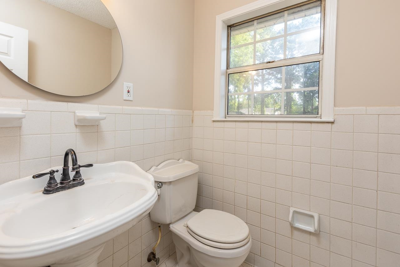 2718 Kate Bond Road Memphis, TN 38133 - Photo 21 of 39 Bathroom featuring a wainscoted wall and tile walls