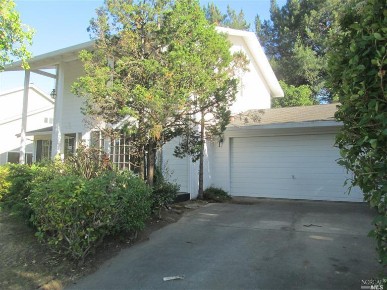 front view with driveway to garage