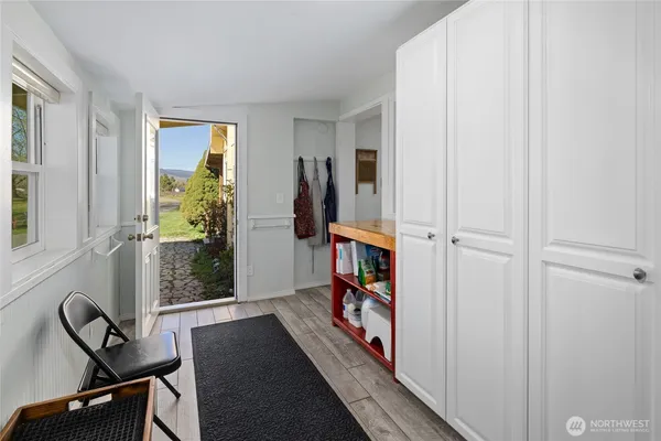 a view of a livingroom with furniture and a window