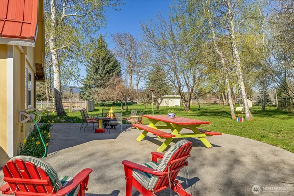 a view of backyard with outdoor seating