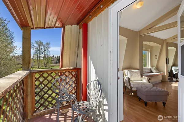 a very nice looking room with a large window and a couch