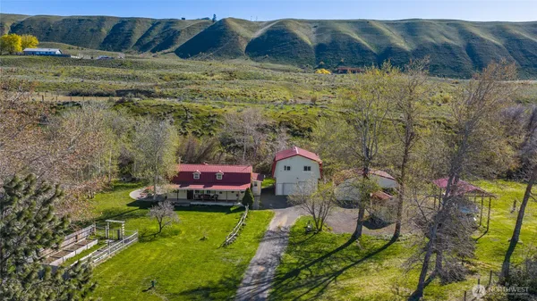 a view of a patio with table and chairs and potted plants